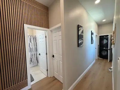 a room with a hallway with a door and a room with at Escondido Back Unit by sdstay in Escondido