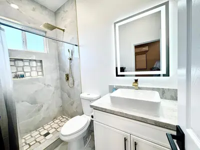 a white bathroom with a sink and a toilet at Escondido Back Unit by sdstay in Escondido