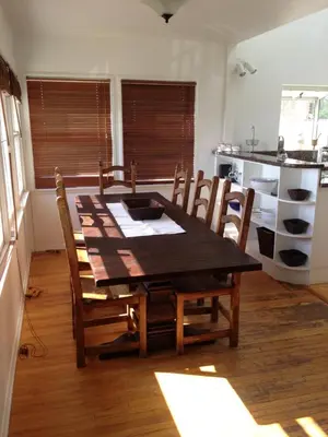 a dining room table and chairs in a kitchen at Classic Laguna Cottage in Laguna Beach