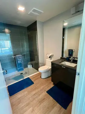 a bathroom with a toilet and a sink and a shower at The Daisy-Highrise 2BR Marina View,Pool,Jacuzzi,Gym&Parking in San Diego