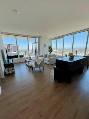 a large living room with a large floor to ceiling windows at The Daisy-Highrise 2BR Marina View,Pool,Jacuzzi,Gym&Parking in San Diego