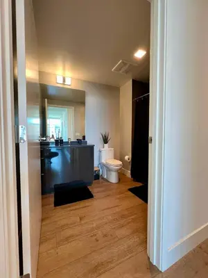 a bathroom with a sink and a toilet in a room at The Daisy-Highrise 2BR Marina View,Pool,Jacuzzi,Gym&Parking in San Diego