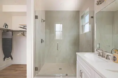 a shower with a glass door in a bathroom at Airy Ocean Beach Home with Coastal Views in San Diego