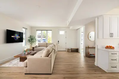 a living room with a couch and a table at Airy Ocean Beach Home with Coastal Views in San Diego