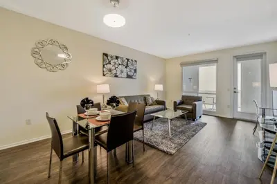 a living room with a couch and a table at Global Luxury Suites Mission Valley in San Diego