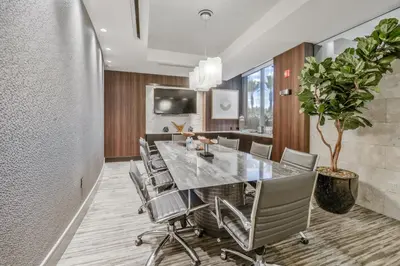 a dining room with a large table and chairs at Global Luxury Suites Mission Valley East in San Diego