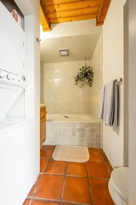 a bathroom with a tub and a toilet and a sink at 4 Bedroom With Pool in Oceanside