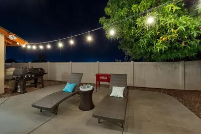 a patio with two chairs and a table and a piano at San Diego 4-Bedroom Home with POOL and Jacuzzi in Rancho Bernardo