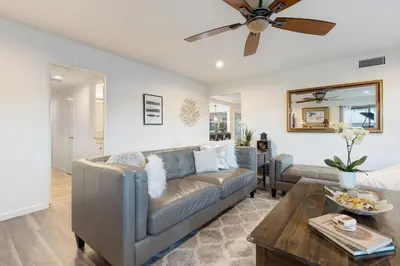 a living room with a couch and a ceiling fan at San Diego 4-Bedroom Home with POOL and Jacuzzi in Rancho Bernardo