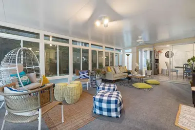 a living room with a swing chair and furniture at San Diego 4-Bedroom Home with POOL and Jacuzzi in Rancho Bernardo