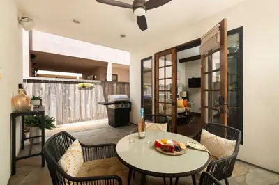 a dining room with a table and chairs and a room at Coastal Oasis Walk to Ocean Bay and Rooftop Deck in San Diego