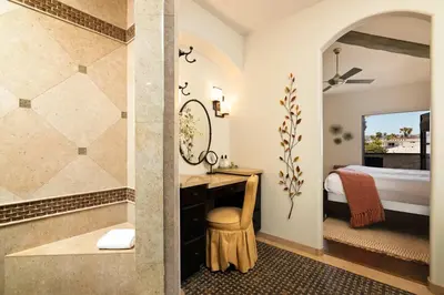 a bathroom with a shower and a bedroom with a bed at Coastal Oasis Walk to Ocean Bay and Rooftop Deck in San Diego