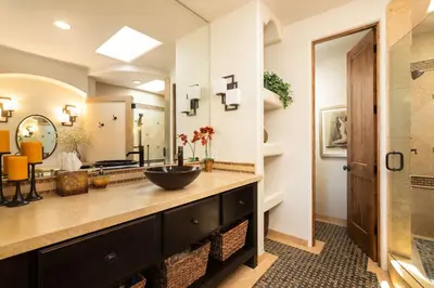 a bathroom with a sink and a mirror at Coastal Oasis Walk to Ocean Bay and Rooftop Deck in San Diego