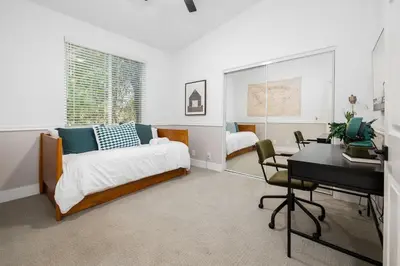 a bedroom with a bed and a desk and a desk at Gated Home With Pool & Hot Tub in Vista