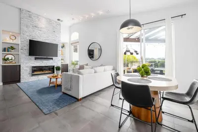 a living room with a white couch and a table at Gated Home With Pool & Hot Tub in Vista