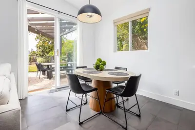 a dining room with a table and chairs at Gated Home With Pool & Hot Tub in Vista