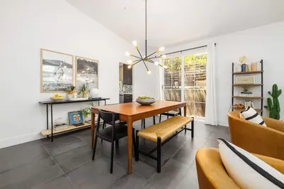 a dining room with a table and a couch at Gated Home With Pool & Hot Tub in Vista