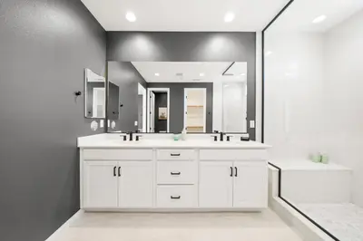 a white bathroom with a sink and a mirror at #Marbella Lane - Curated 5BR in Upscale RMV Haven in Ladera Ranch