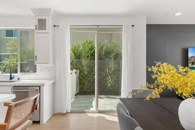 a kitchen and dining room with a sliding glass door at #Marbella Lane - Curated 5BR in Upscale RMV Haven in Ladera Ranch