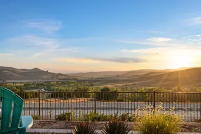 a view of the valley from the balcony of a house at #Marbella Lane - Curated 5BR in Upscale RMV Haven in Ladera Ranch