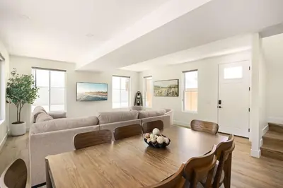 a living room with a couch and a table at Ocean Beach Getaway with Peek Views in San Diego