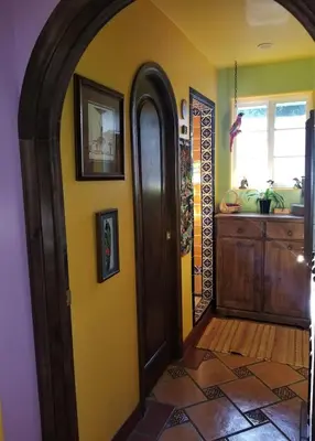 an archway leading to a kitchen in a home at La Casita Private Resort Spa and Mini Golf Course in Alpine