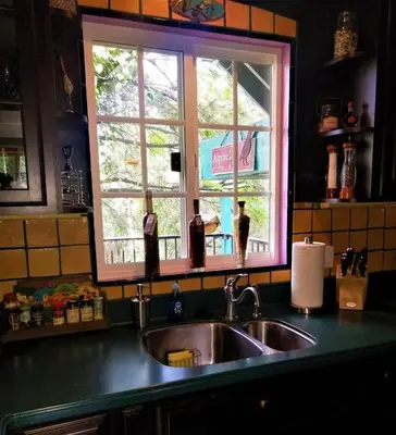 a kitchen counter with a sink and a window at La Casita Private Resort Spa and Mini Golf Course in Alpine