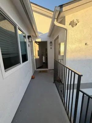 a hallway of a house with a porch and a door at Stylish 1BR Near Downtown, Beaches & North Park in San Diego