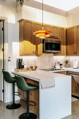 a kitchen with wooden cabinets and green bar stools at Central SD, Luxury Home and Casita, Pool, BBQ, Sleeps10 in La Mesa