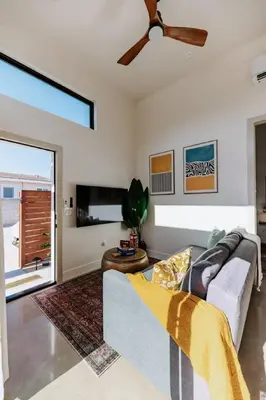 a living room with a couch and a ceiling fan at Central SD, Luxury Home and Casita, Pool, BBQ, Sleeps10 in La Mesa