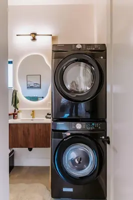 a washer and dryer in a bathroom with a sink at Central SD, Luxury Home and Casita, Pool, BBQ, Sleeps10 in La Mesa