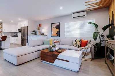 a living room with a couch and a table at Central SD, Luxury Home and Casita, Pool, BBQ, Sleeps10 in La Mesa