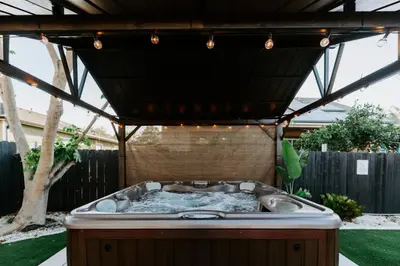 a hot tub in the middle of a backyard at Central SD, Luxury Home and Casita, Pool, BBQ, Sleeps10 in La Mesa