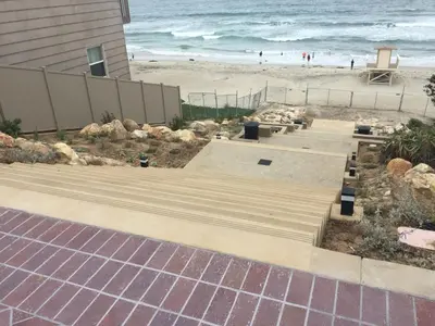 a house with a solar panel next to a beach at Beach Oasis in Carlsbad Village in Carlsbad