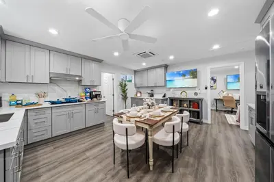 a kitchen with a table and chairs in a kitchen at Entire Private Home with 3 Bedrooms 3 Bathrooms, House with Yard, King Bed, Prime Location, Available Now in San Diego