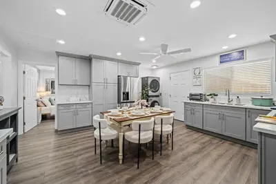 a kitchen with a table and chairs in it at Entire Private Home with 3 Bedrooms 3 Bathrooms, House with Yard, King Bed, Prime Location, Available Now in San Diego