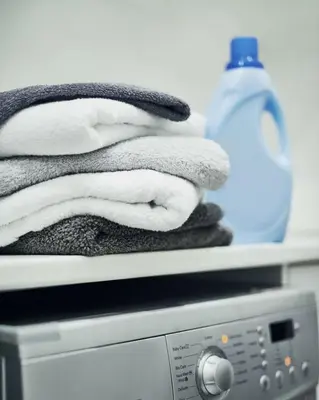 a pile of towels sitting on top of a microwave at Entire Private Home with 3 Bedrooms 3 Bathrooms, House with Yard, King Bed, Prime Location, Available Now in San Diego