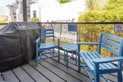 two blue chairs and a table on a deck at Modern Surf Themed Home - Heart of Gaslamp in San Diego