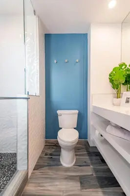 a bathroom with a toilet and a glass shower at Modern Surf Themed Home - Heart of Gaslamp in San Diego