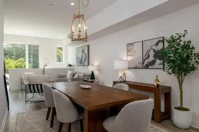 a dining room and living room with a table and chairs at NEW 3br Luxury Townhome - Gaslamp - Balboa Park in San Diego