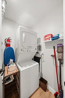 a white refrigerator with a computer on top of it at Del Mar Retreat - Laundry BBQ Firepit AC Patio in San Diego