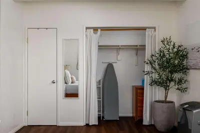 a bedroom with a door leading to a bedroom with a bed at Chic Beach Retreat - Newly Furnished 1BR in Ocean Beach! in San Diego