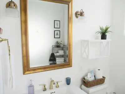a bathroom with a mirror and a sink at Saint Ann's Court in Laguna Beach