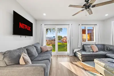 a living room with two couches and a window at Bay Park Bliss Ocean Views Pickleball and Jacuzzi in San Diego