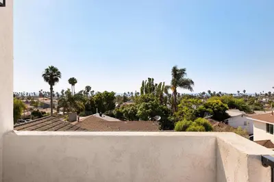 a view of a city with palm trees and buildings at Coastal Ocean Beach Compound Escape in San Diego