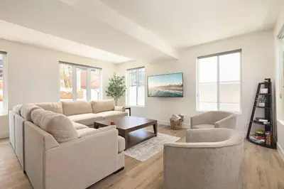 a living room with a couch and two chairs and a table at Coastal Ocean Beach Compound Escape in San Diego