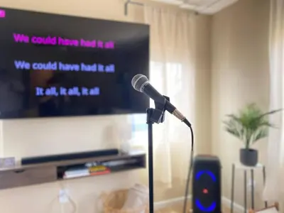 a microphone in front of a tv in a room at Cozy Home in National City 15 min from San Diego in National City