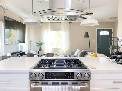 a kitchen with a stove top oven in a kitchen at Cozy Home in National City 15 min from San Diego in National City