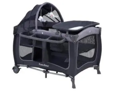a black folding baby cart sitting on a white background at North Park Modern 2BR King Beds, Workspaces, Parking in San Diego