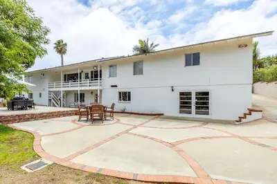 an exterior view of a white house with a patio at Spacious 2 Bed in Carlsbad in Carlsbad